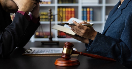stressed client consulting with a lawyer